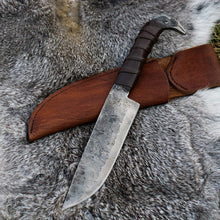 Odin's Raven Viking seax knife and its handmade cowhide leather sheath laid on grey fur