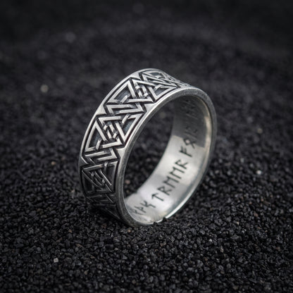 Valknut and rune band ring in 925 sterling silver on black volcanic sand