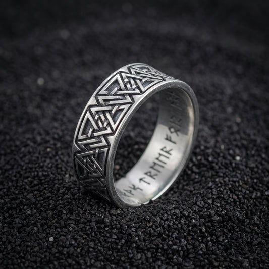 Valknut and rune band ring in 925 sterling silver on black volcanic sand