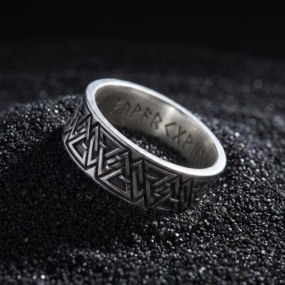Valknut rune ring from the side, polished rims and engraved runes inside the band