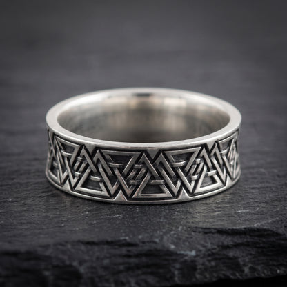 Close view of the interlocking valknut symbols on the oxidised silver band