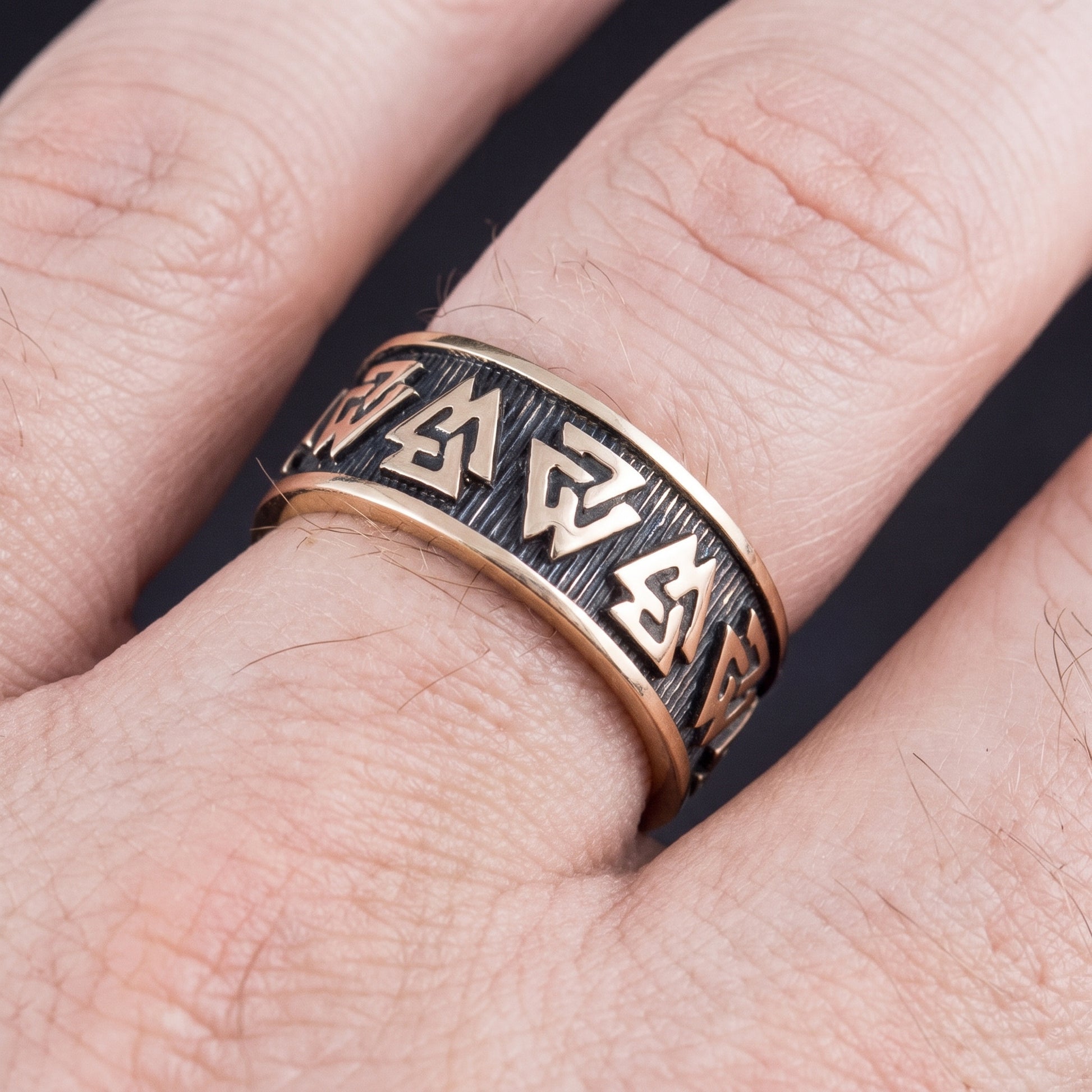 Bronze Valknut Viking ring worn on a finger, showing the width of the band