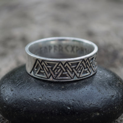 Sterling silver Valknut wedding ring seen front on, interlocking valknut frieze