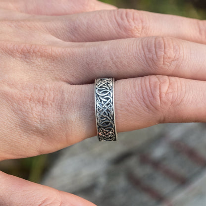 Viking wedding band worn on the hand, showing the ring on the finger