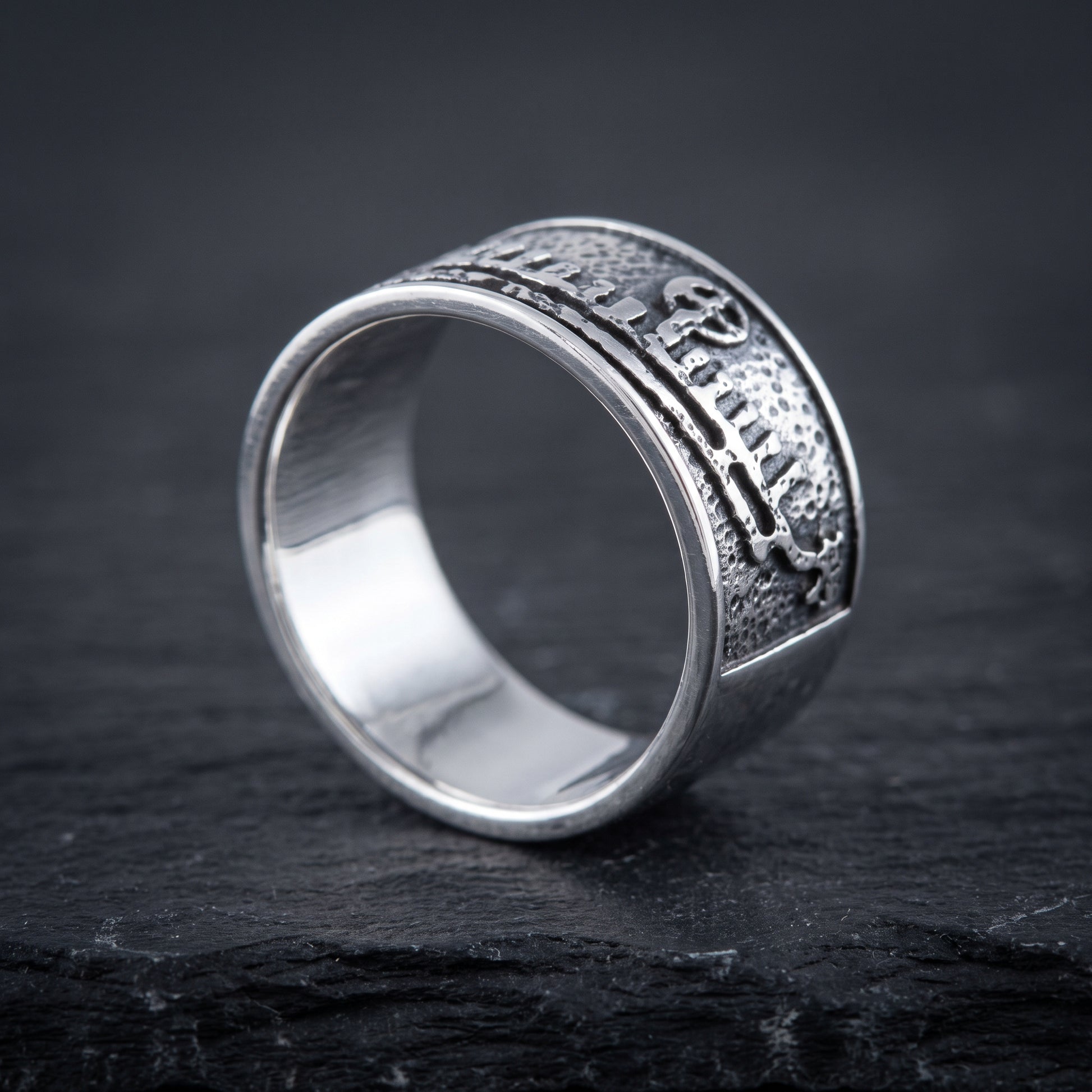 Silver drakkar Viking ring from the side, flat band of even width and polished interior