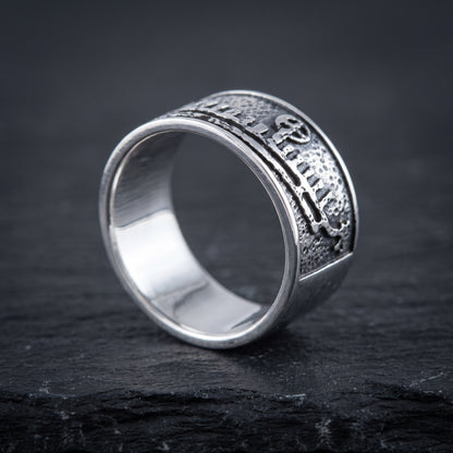 Silver drakkar Viking ring from the side, flat band of even width and polished interior