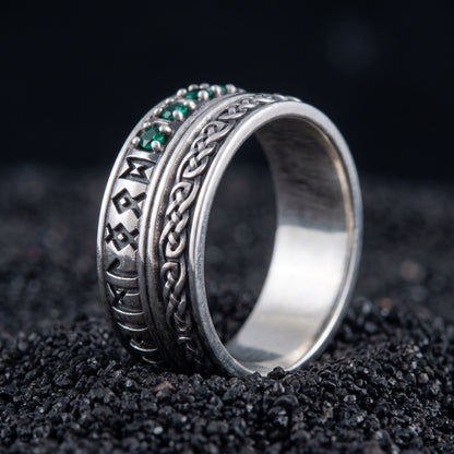 Sterling silver Viking wedding ring with Elder Futhark runes and green cubic zirconia on black volcanic sand
