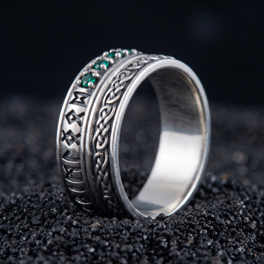 Sterling silver Viking wedding ring with Elder Futhark runes and green cubic zirconia on black volcanic sand