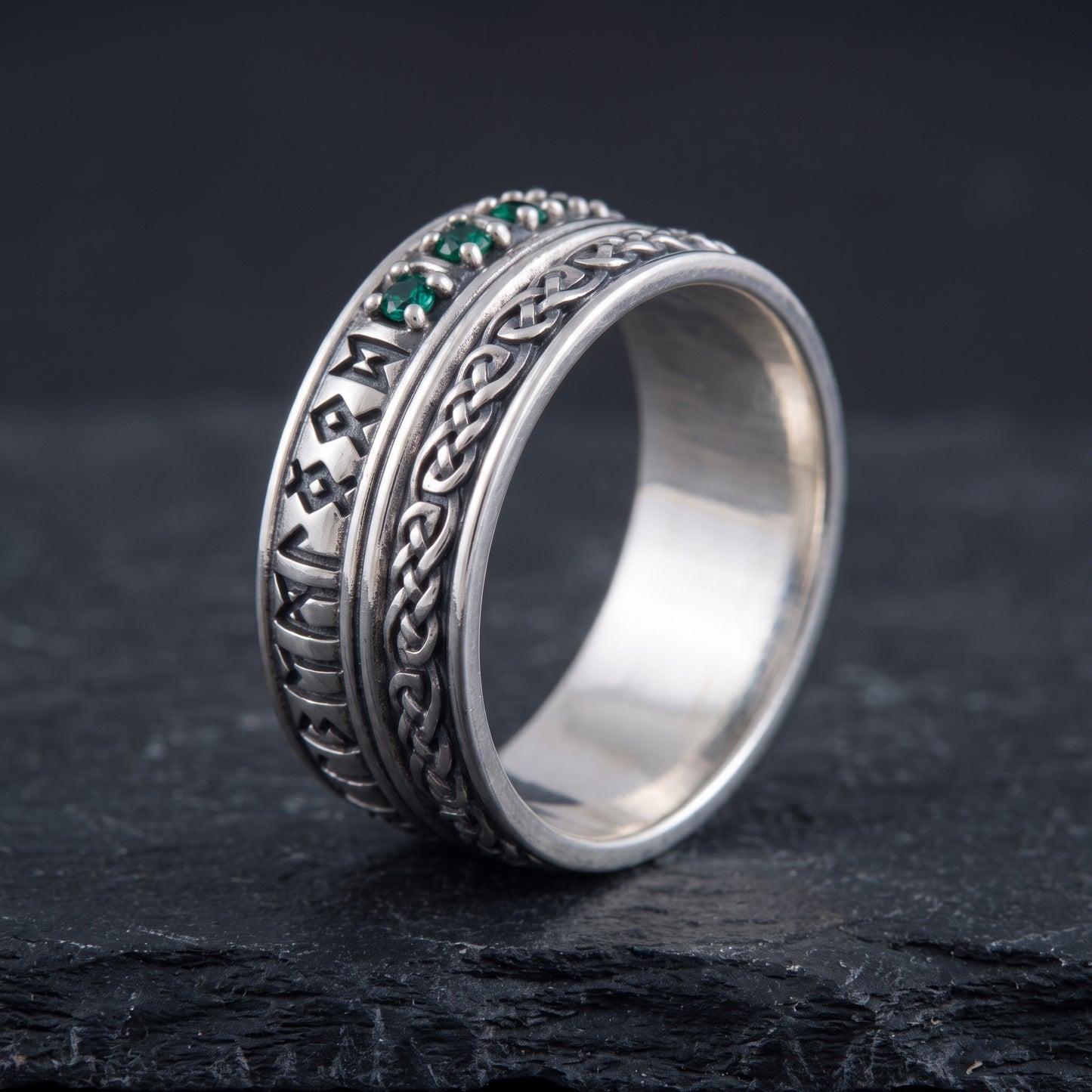 Silver Viking ring from the side, polished interior and layered rune and knotwork bands