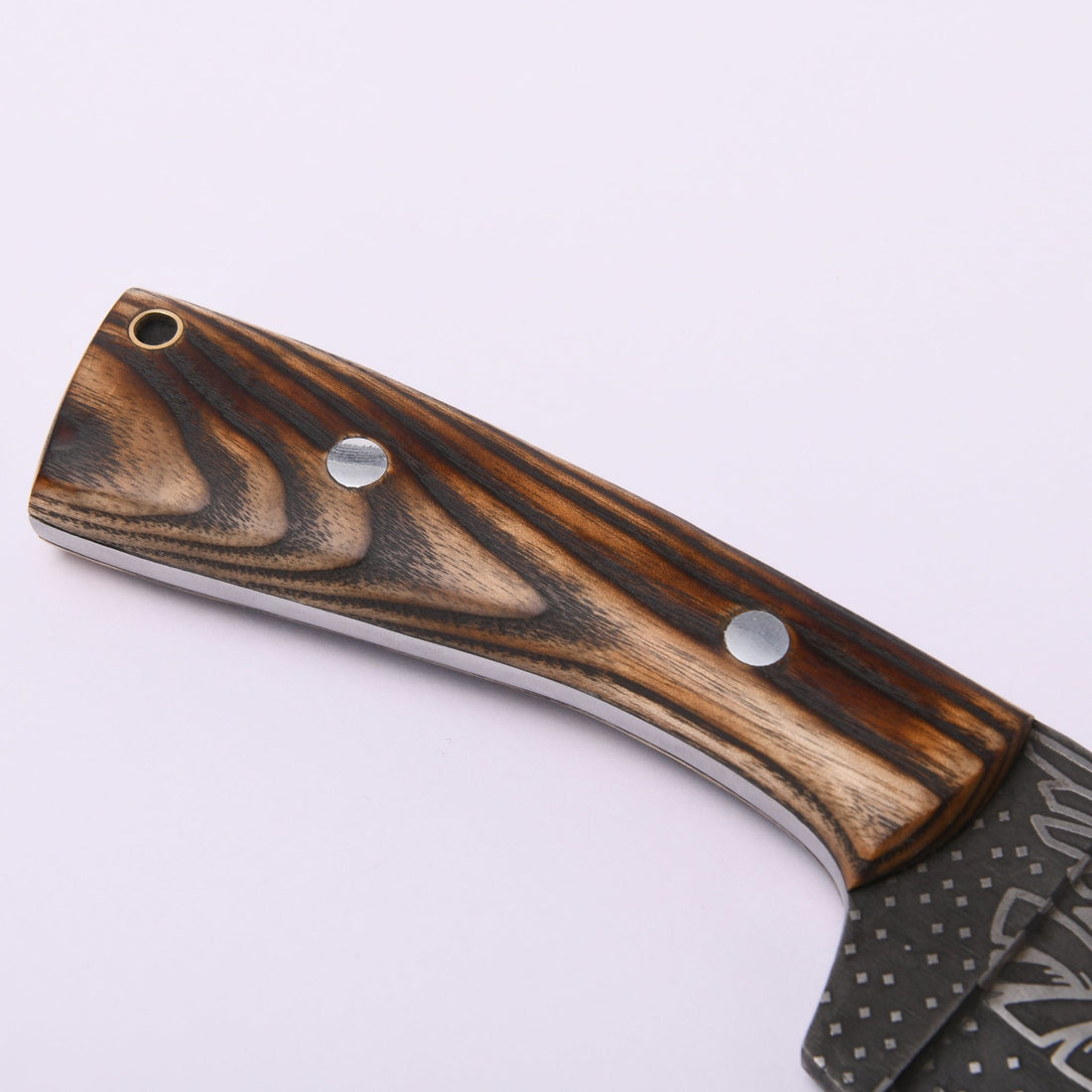 Ash-wood handle of the Huginn & Muninn seax knife showing the grain, two pins and the lanyard hole