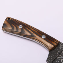 Ash-wood handle of the Huginn & Muninn seax knife showing the grain, two pins and the lanyard hole
